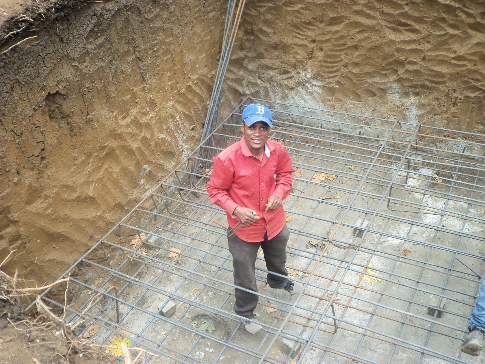 Metal reinforcement and anchor bolt installation for tower base